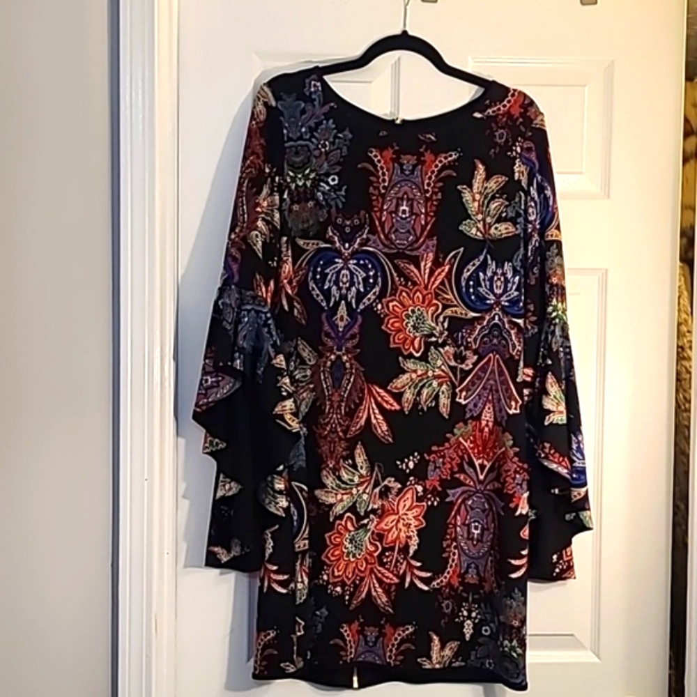 Black reverse able dress with a beautiful multi-color paisley print inside.